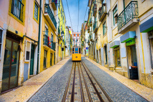 Lisbon, Portugal old town streets and street car.